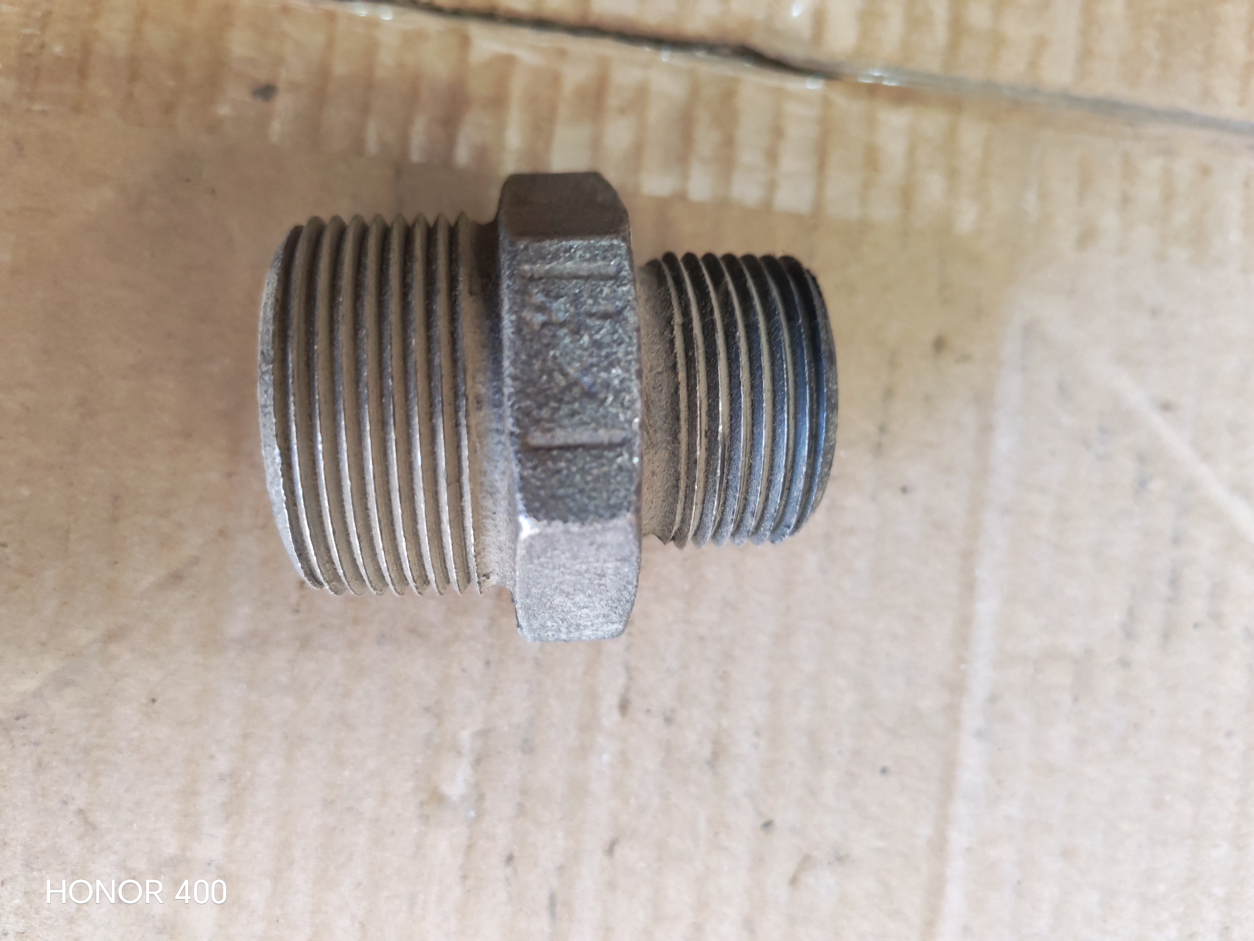 NIPPEL REDUCER THREADED BLACK 1 1/4' x 1'